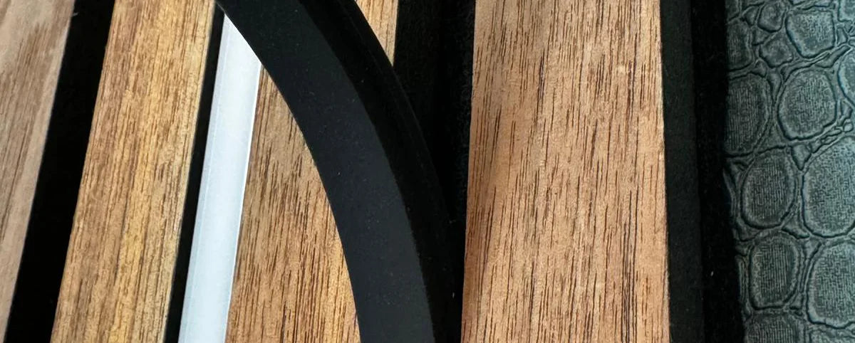 Image shows Blaq Aura being placed in to Slat Wall.