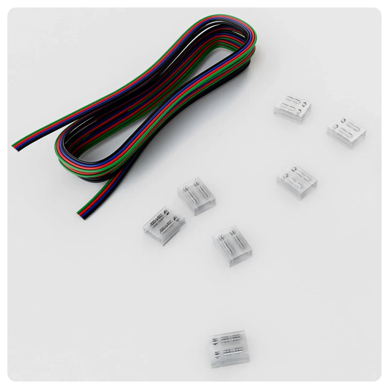 Colorful RGB LED strip wires with small clear connectors on a white surface