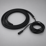 Unlit black BLAQ IRIS LED strip shown coiled with its attached connection lead
