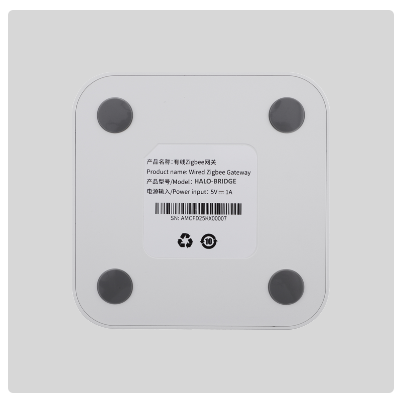 Bottom view of HALO Bridge wired Zigbee gateway with four rubber feet and product label