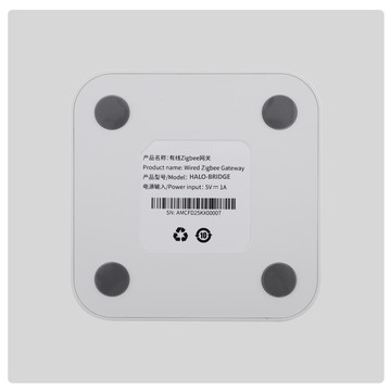 Bottom view of HALO Bridge wired Zigbee gateway with four rubber feet and product label