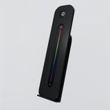 Black RGB LED remote control with a vertical colour slider and matching holder
