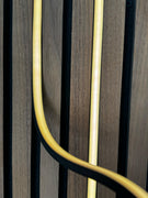 BLAQ Aura 2 Strip Slat Wall Lighting Kit mounted on wooden slats with two yellow light bars