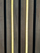 Two vertical warm LED light strips mounted on a wood slat wall.