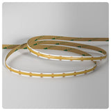 Unlit Seamless adjustable white COB LED strip shown in loose coils