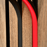 Animated BLAQ IRIS LED strip cycling through colours between timber wall slats