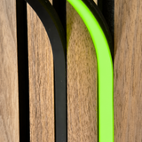 BLAQ IRIS slat-wall LED strip showing green light between timber slats