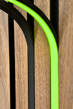 BLAQ IRIS slat-wall LED strip showing green light between timber slats