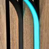 BLAQ IRIS slat-wall LED strip showing cyan light between timber slats