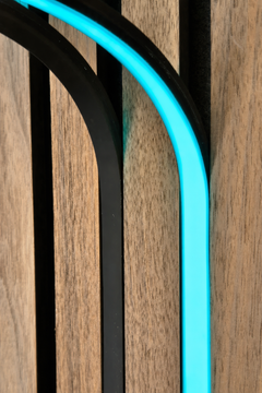 BLAQ IRIS slat-wall LED strip showing cyan light between timber slats