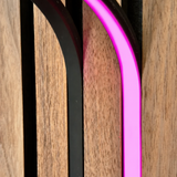 BLAQ IRIS slat-wall LED strip showing pink light between timber slats