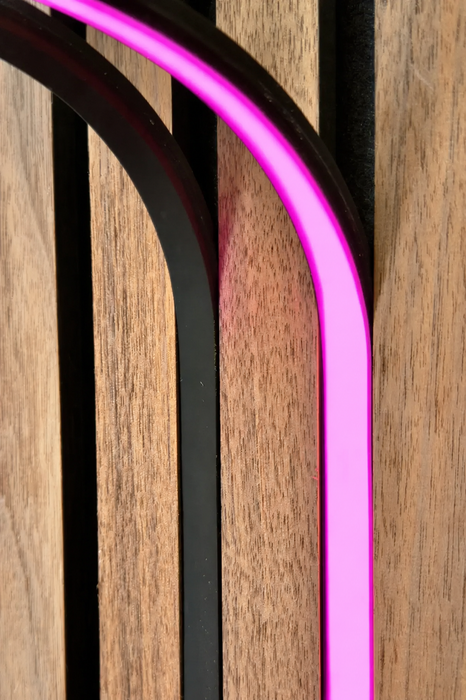 BLAQ IRIS slat-wall LED strip showing pink light between timber slats