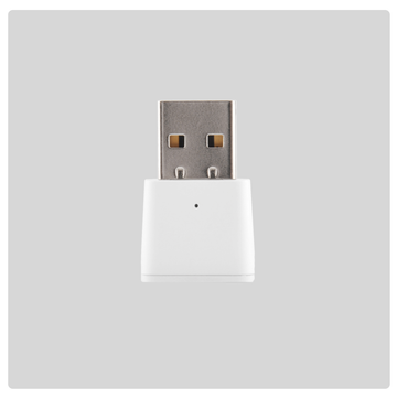 HALO Zigbee range extender USB dongle shown on a grey background from a different angle