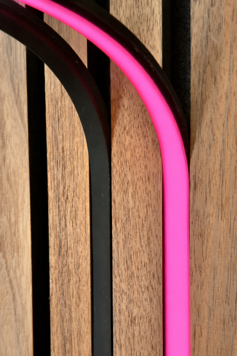 BLAQ IRIS slat-wall LED strip showing pink light between timber slats