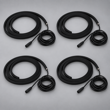 Four unlit black BLAQ IRIS LED strips shown coiled with their connection leads